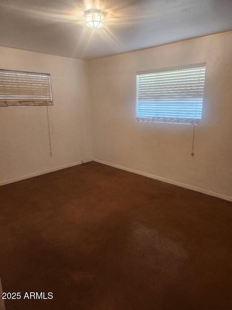 7 East Beautiful Lane Phoenix, AZ 85042 - Photo 13 of 26 an empty room with a empty space and window