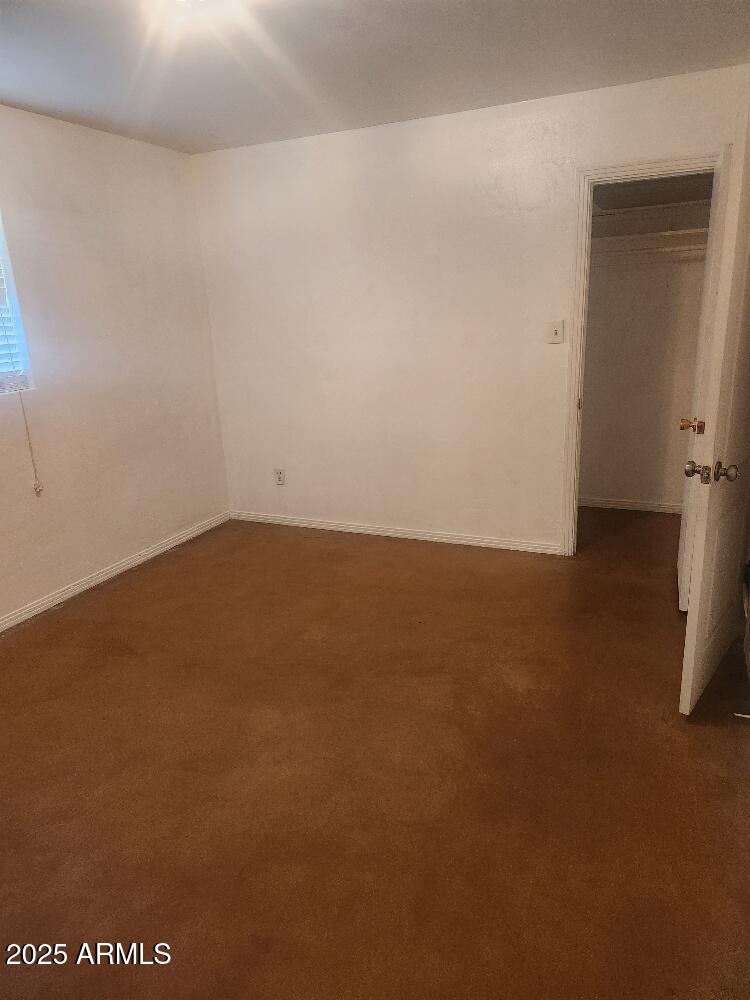 7 East Beautiful Lane Phoenix, AZ 85042 - Photo 14 of 26 an empty room with a empty space