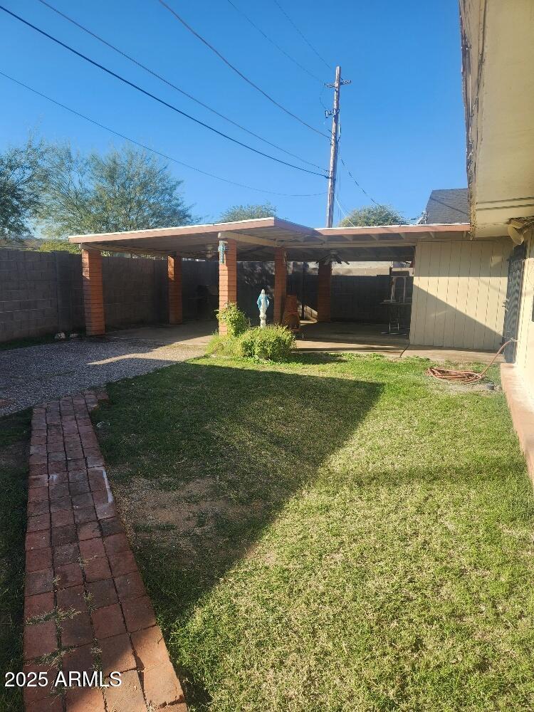 7 East Beautiful Lane Phoenix, AZ 85042 - Photo 2 of 26 a front view of a house with a yard
