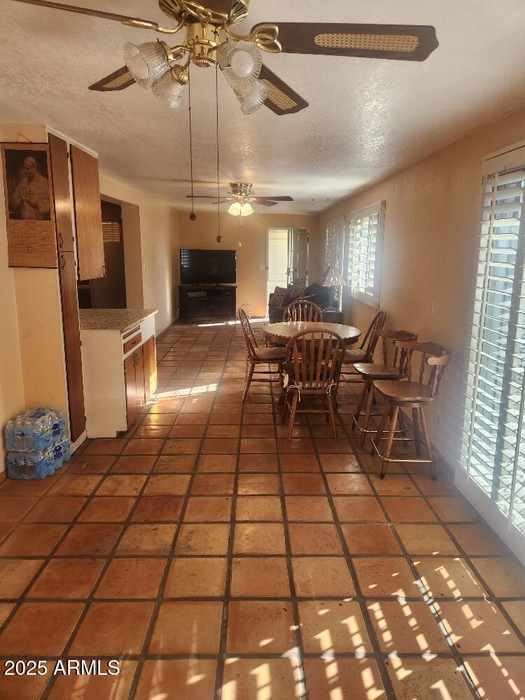 7 East Beautiful Lane Phoenix, AZ 85042 - Photo 23 of 26 a outdoor space with lots of white furniture and chandelier