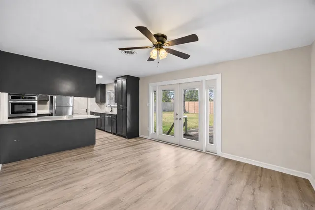 a view of a kitchen with a sink and a window