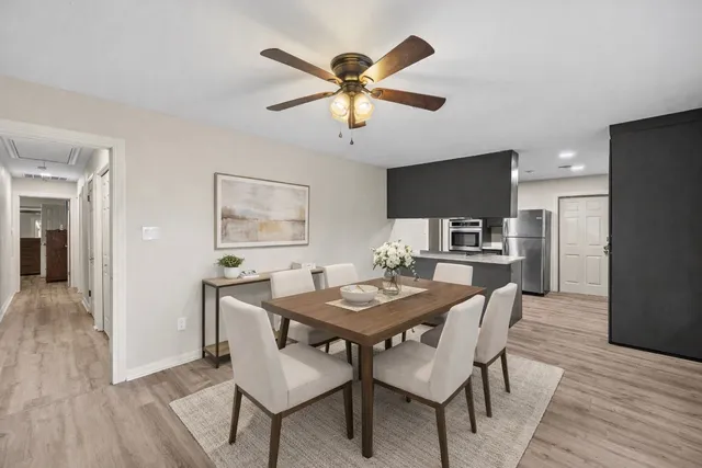 a dining room with furniture and window