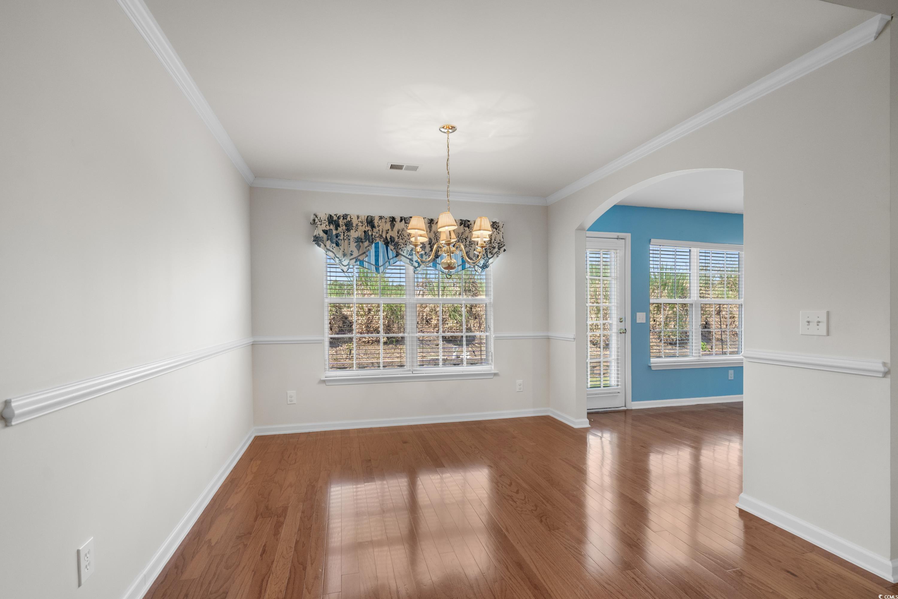 346 Whitchurch Street Murrells Inlet, SC 29576 - Photo 14 of 34 Unfurnished dining area with crown molding, an inv