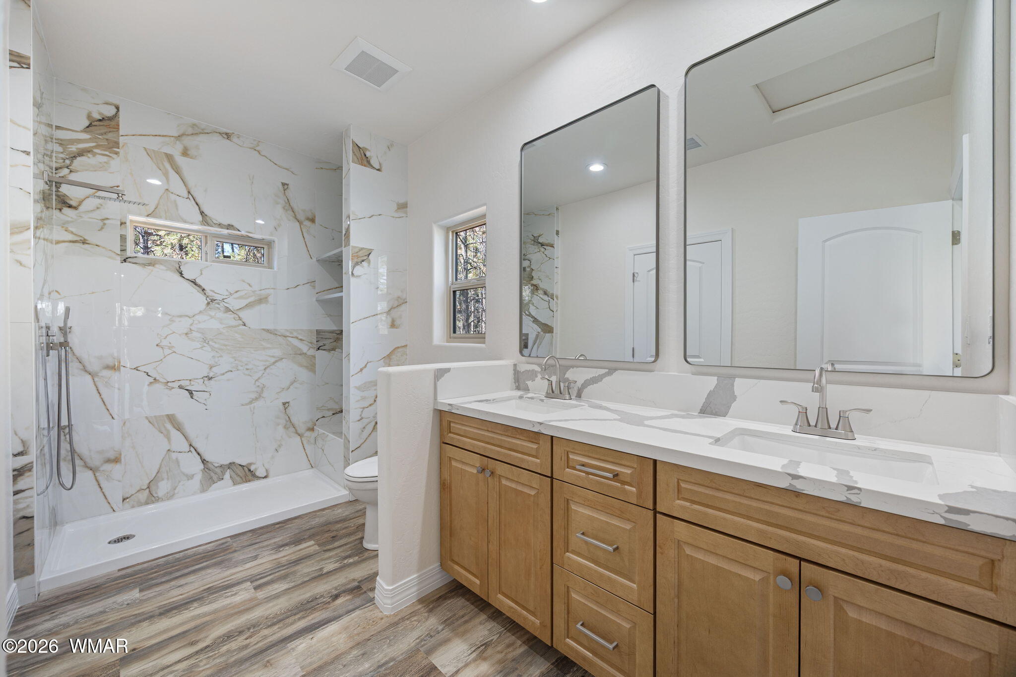 2273 Constellation Lane Overgaard, AZ 85933 - Photo 17 of 31 a bathroom with double vanity sink and a mirror