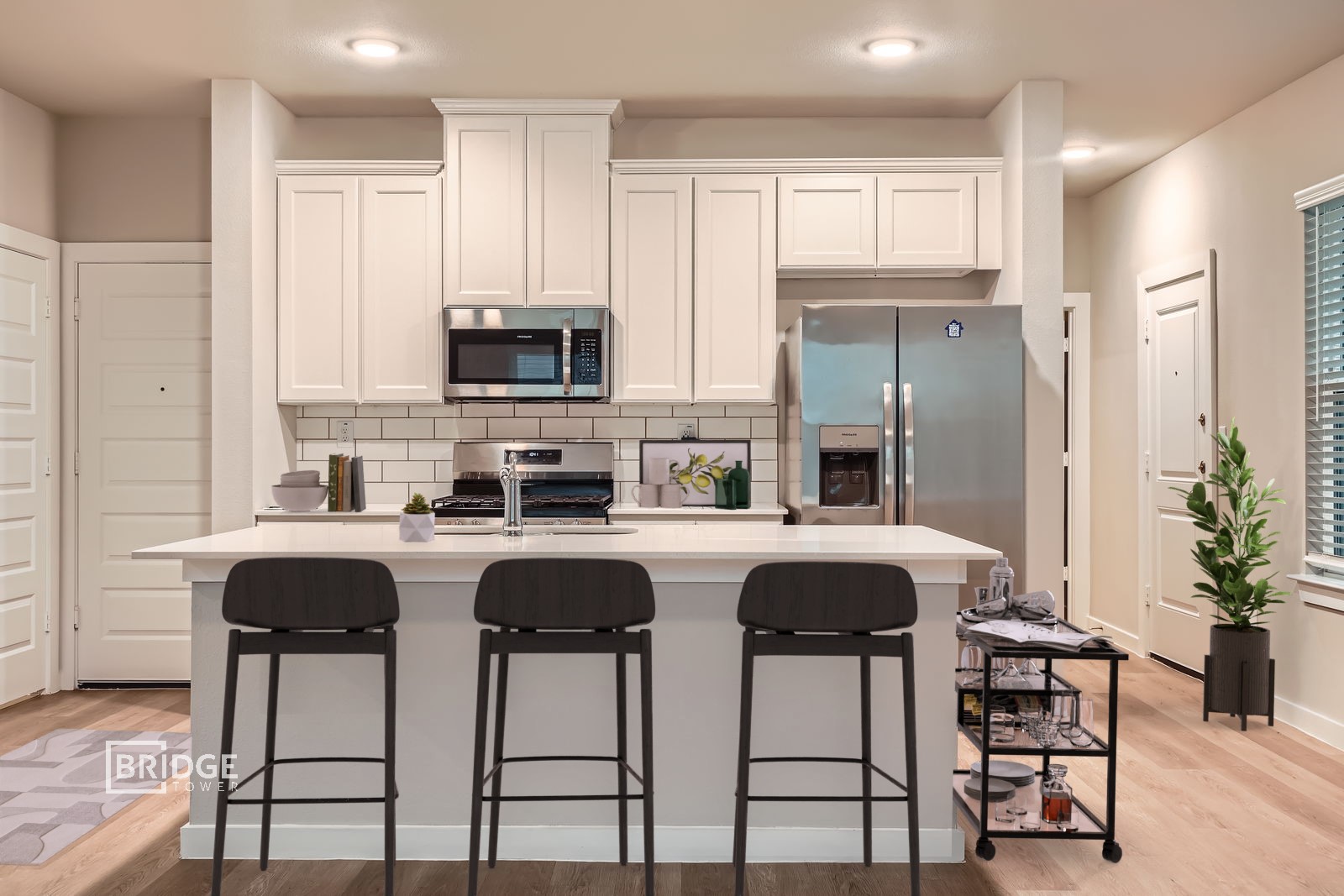 134 Pecan Lane Lake Jackson, TX 77566 - Photo 6 of 12 a kitchen with kitchen island granite countertop a cabinets and a stove with wooden floor