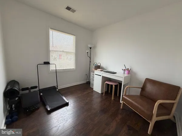 a room with furniture window and wooden floor