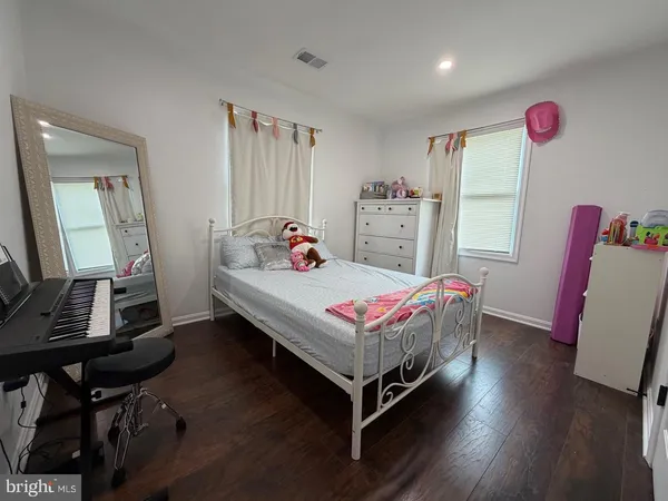 a bedroom with a bed and a table in it