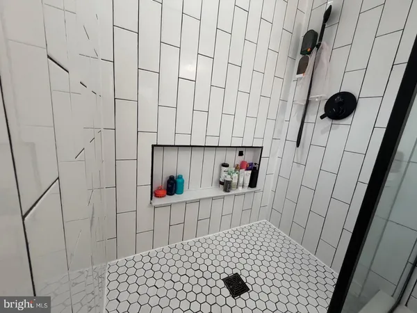 a bathroom with a sink and a shower