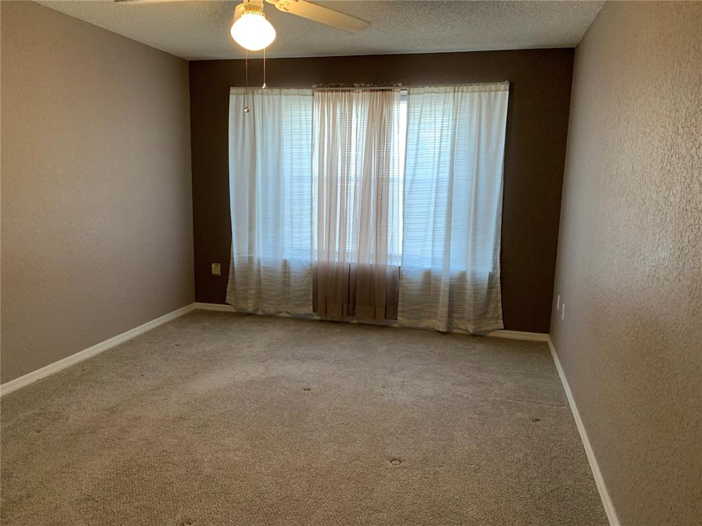 8340 Southwest 108th Pl Road Ocala, FL 34481 - Photo 11 of 32 Master bedroom - newer carpet