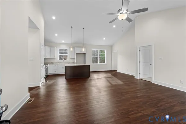 a view of kitchen with sink and wooden floor