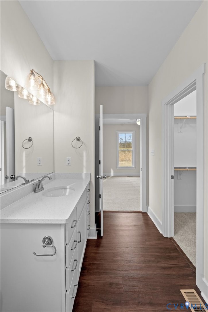 4522 Old Stage Road Freeman, VA 23856 - Photo 30 of 51 a spacious bathroom with a double vanity sink and mirror