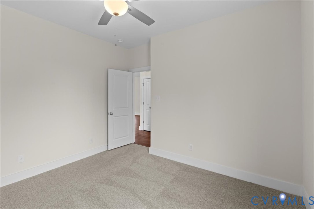 4522 Old Stage Road Freeman, VA 23856 - Photo 34 of 51 an empty room with a ceiling fan and a window