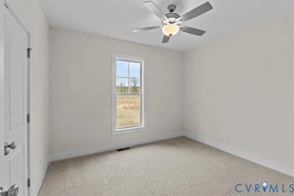 a view of a room wooden floor and window