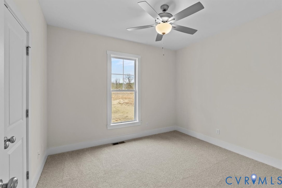 4522 Old Stage Road Freeman, VA 23856 - Photo 35 of 51 an empty room with a window and a fan
