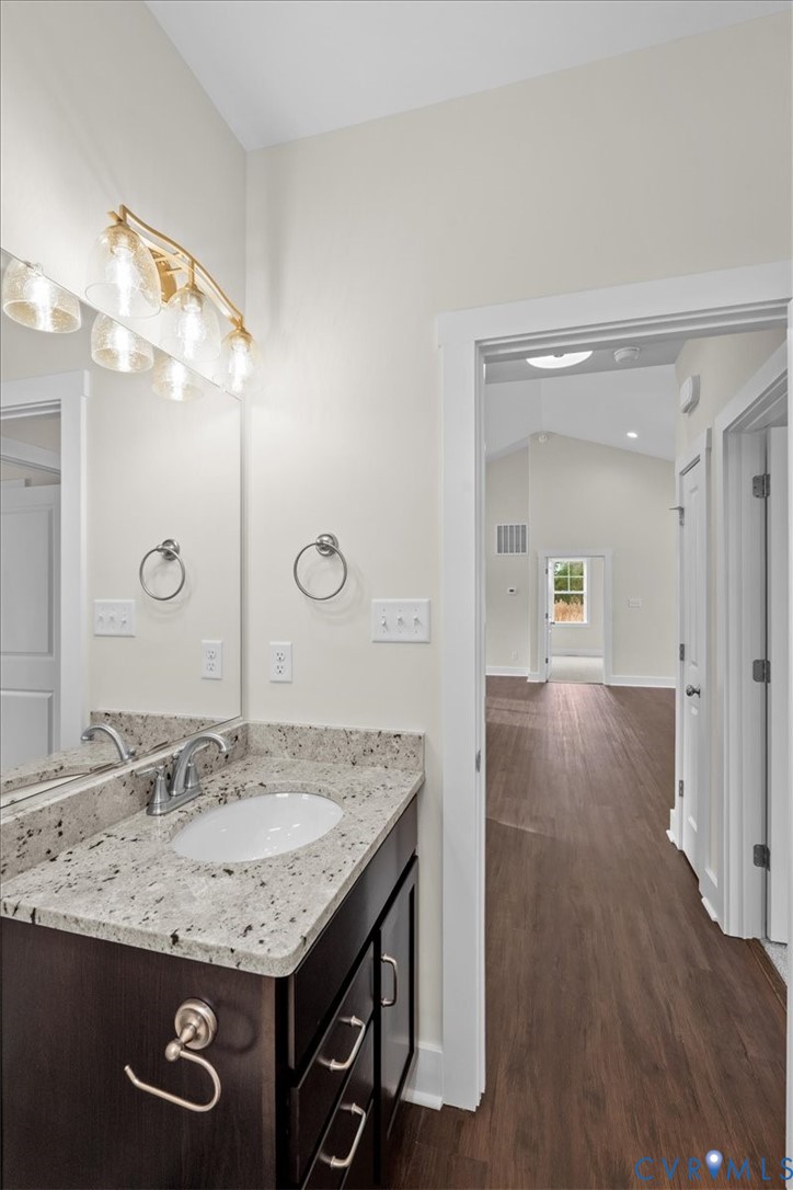 4522 Old Stage Road Freeman, VA 23856 - Photo 38 of 51 a bathroom with a granite countertop sink a large mirror and vanity