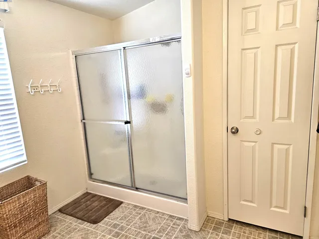 a view of a bathroom with tub and window