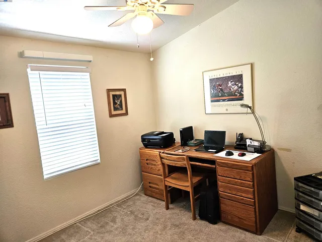 a view of a workspace with furniture