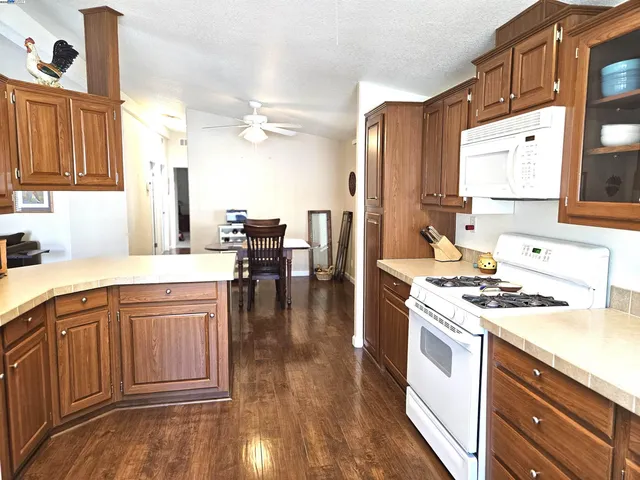 a kitchen with a stove a sink and a refrigerator