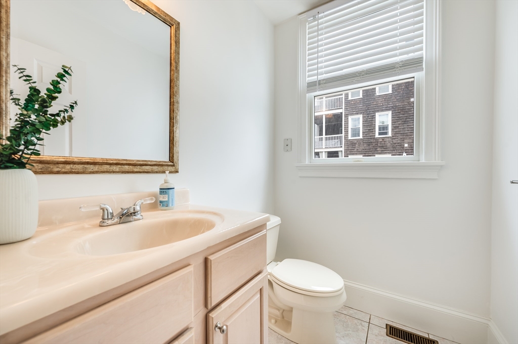 1520 Columbia Road, Unit 2 Boston, MA 02127 - Photo 4 of 16 a bathroom with a sink and a toilet
