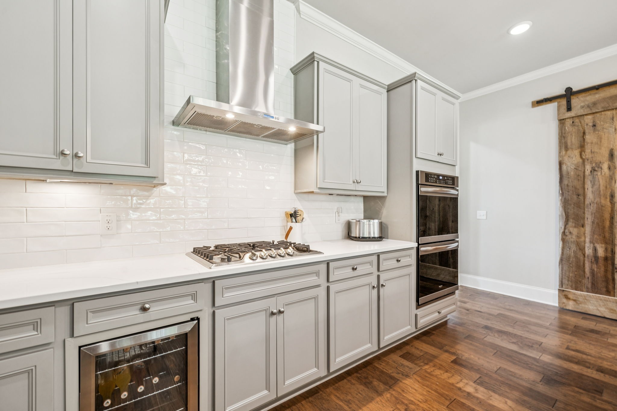 737 Alameda Avenue Nolensville, TN 37135 - Photo 13 of 55 a kitchen with stainless steel appliances white cabinets and a stove top oven