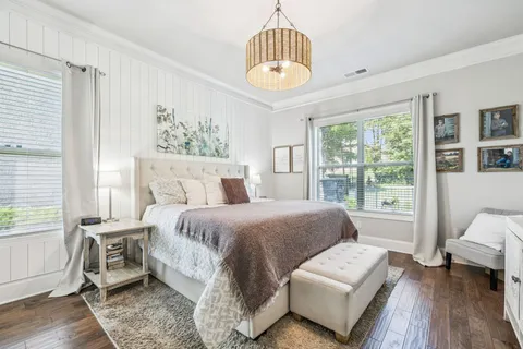 a bathroom with a tub sink and a mirror