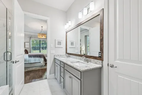 a bathroom with a sink toilet and mirror