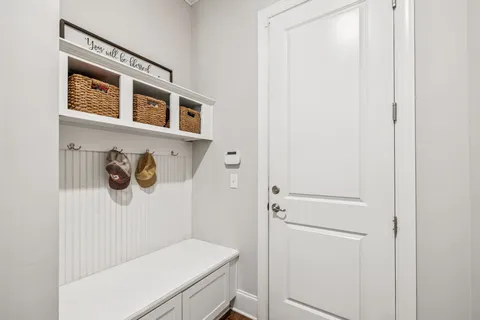 a living room with furniture ceiling fan and a window