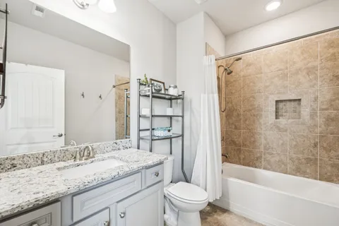 a bedroom with two beds and a window