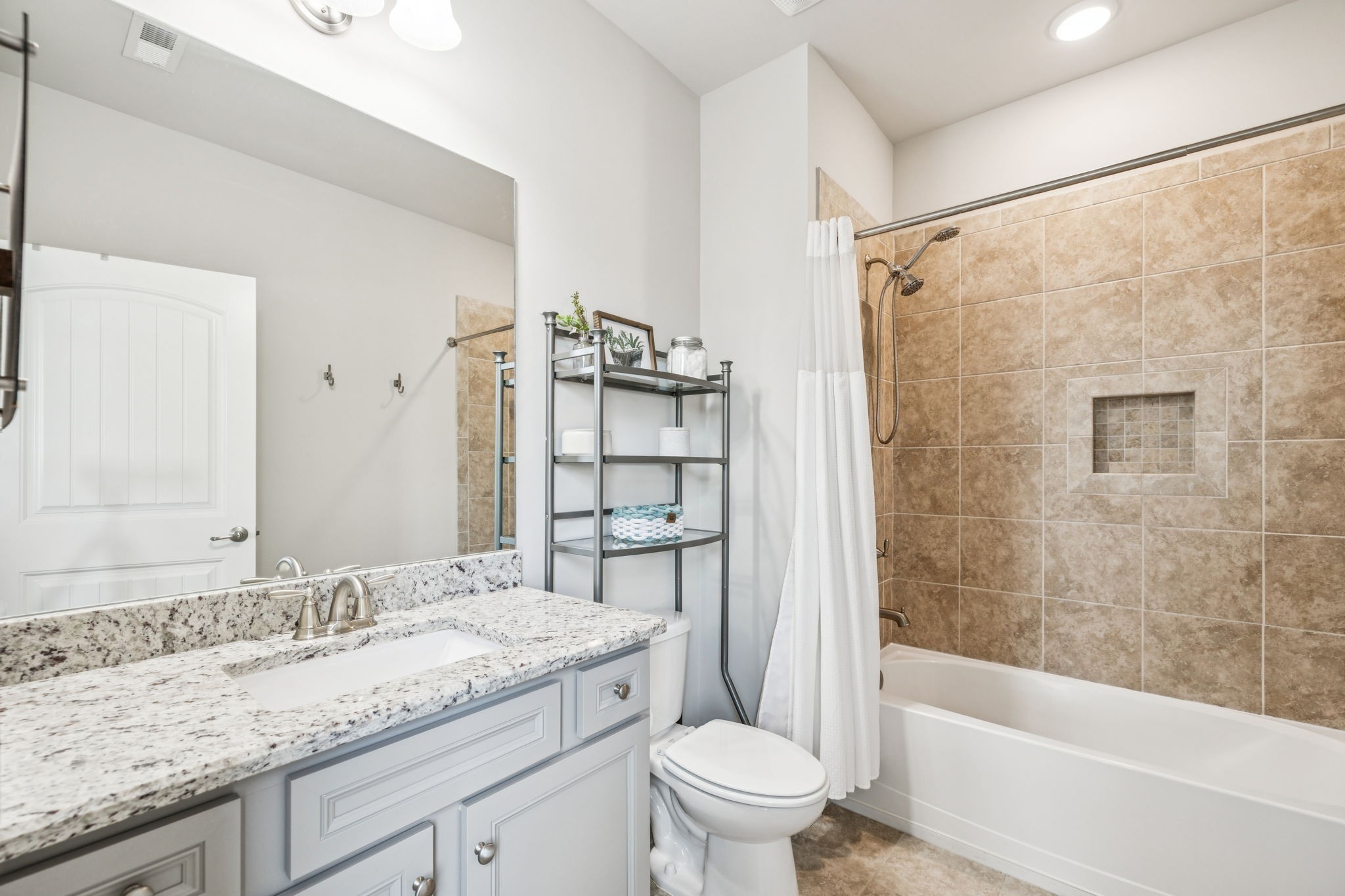 737 Alameda Avenue Nolensville, TN 37135 - Photo 32 of 55 a bathroom with a granite countertop sink a toilet and shower