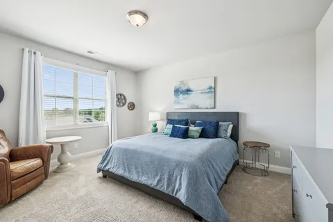 a bathroom with a granite countertop sink mirror and a bath tub