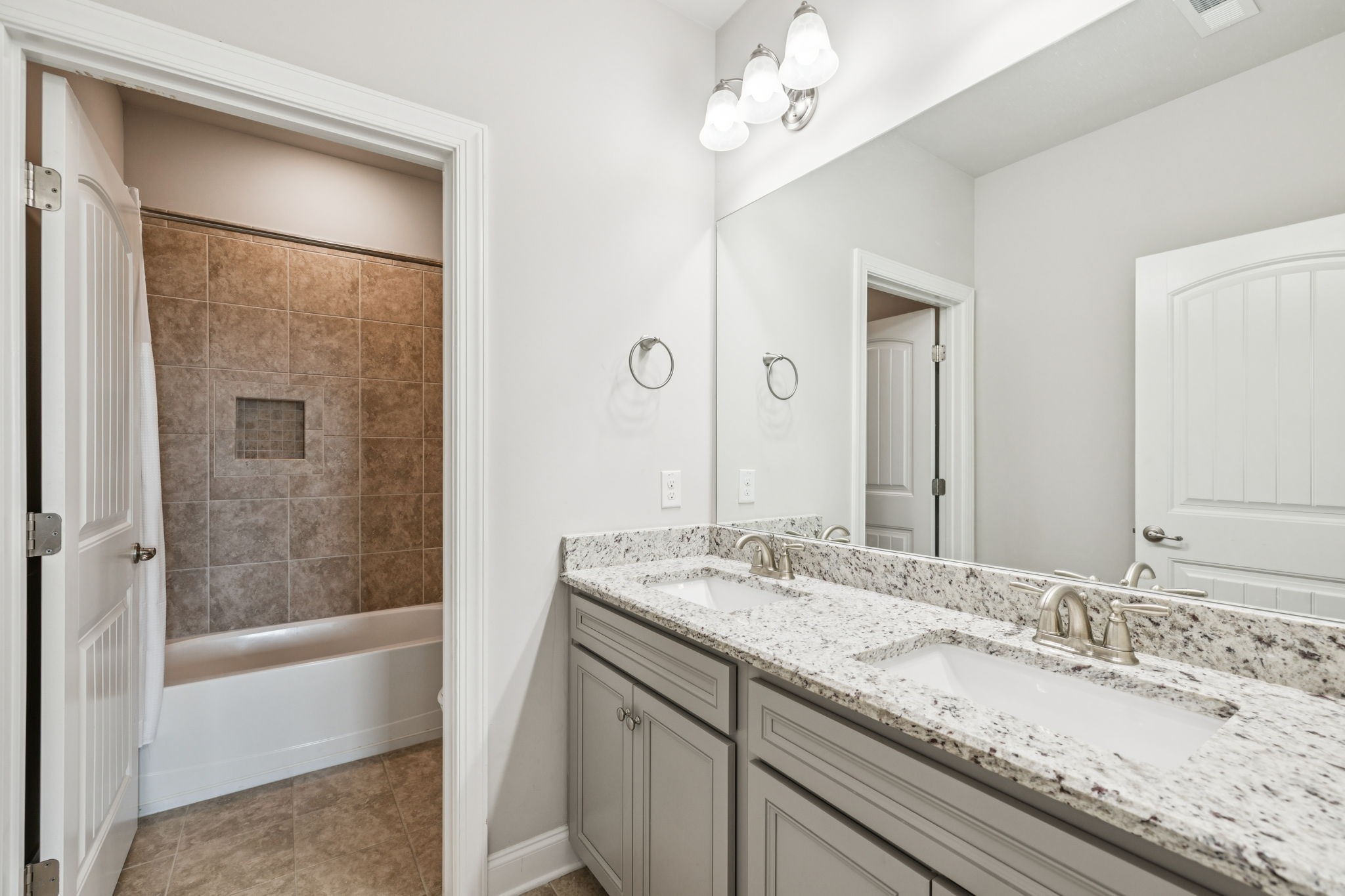 737 Alameda Avenue Nolensville, TN 37135 - Photo 37 of 55 a bathroom with a granite countertop sink mirror and a bath tub