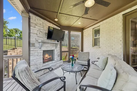 a view of a living room and kitchen with a large window