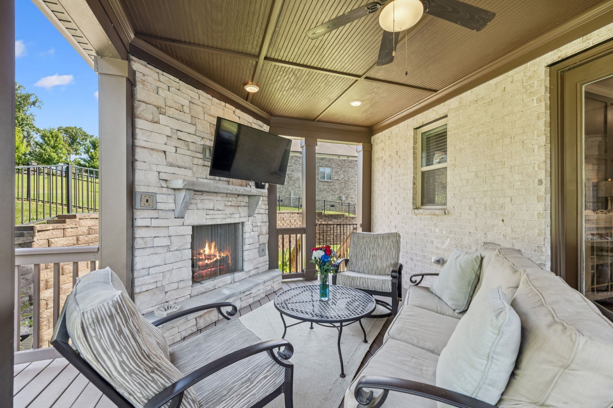 737 Alameda Avenue Nolensville, TN 37135 - Photo 39 of 55 a living room with furniture a flat screen tv and a fireplace