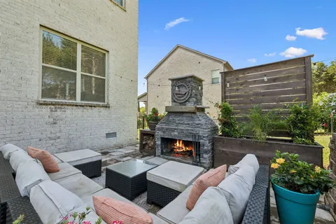 a view of a backyard with sitting area
