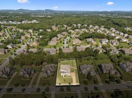 an aerial view of houses with yard