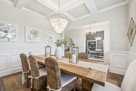 a kitchen with kitchen island a sink appliances and cabinets