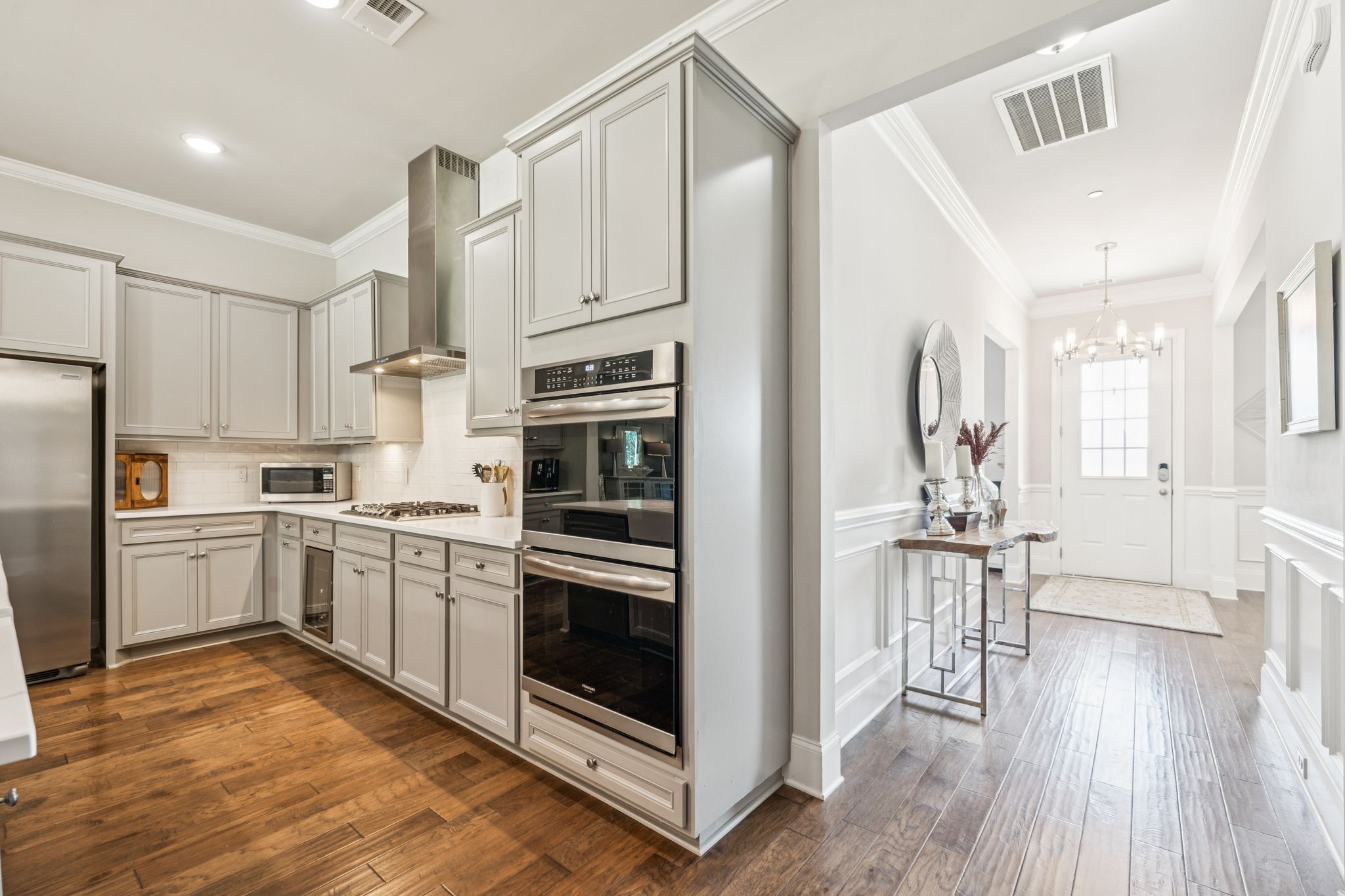 737 Alameda Avenue Nolensville, TN 37135 - Photo 10 of 55 a kitchen with white cabinets and stainless steel appliances
