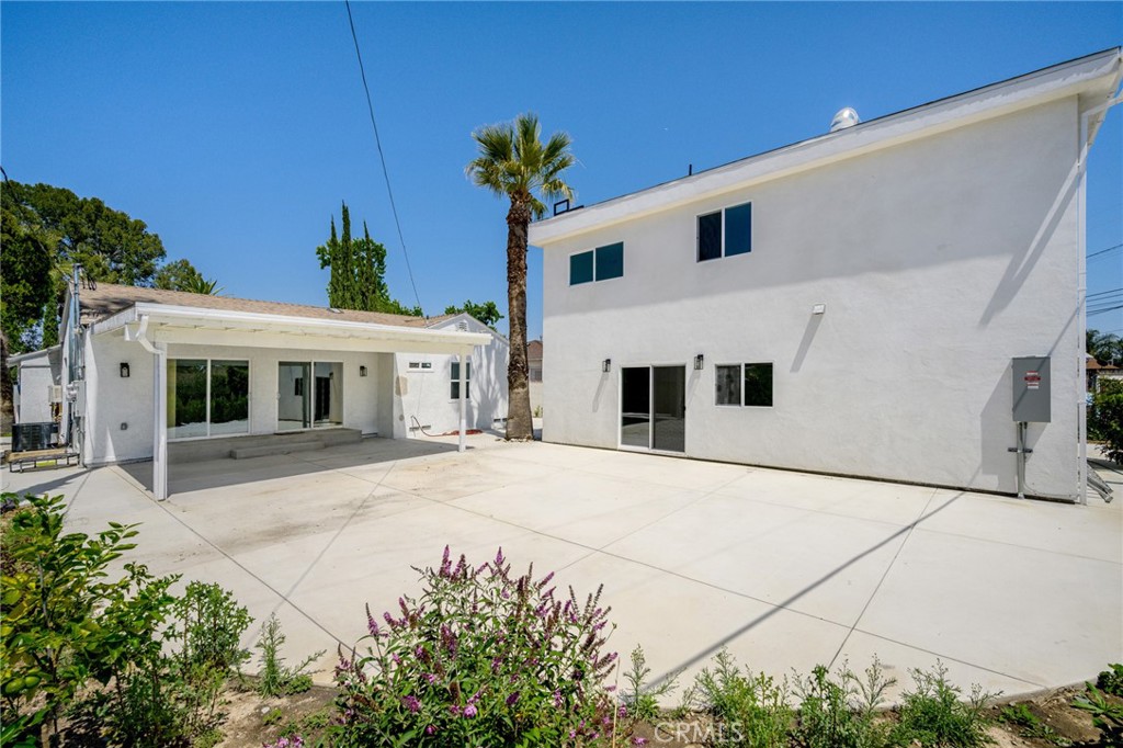 8435 Rincon Avenue Sun Valley, CA 91352 - Photo 59 of 61 a front view of a house with a yard and garage