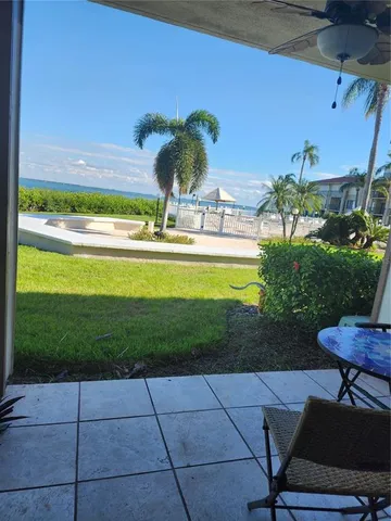 a view of a swimming pool with an outdoor seating