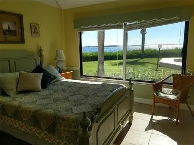 a bedroom with a bed and cupboard