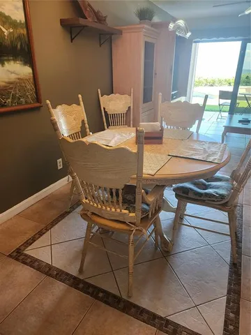 a living room with a bed furniture and a large window