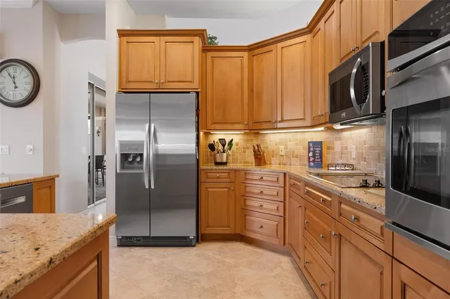 a bedroom with bed and a chandelier
