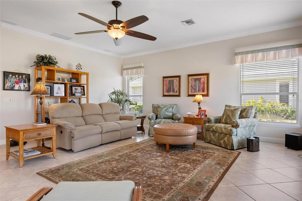 433 Tremingham Way Venice, FL 34293 - Photo 29 of 95 a living room with furniture and a rug