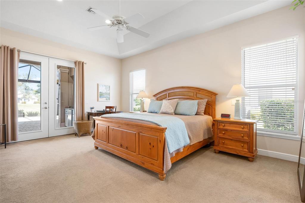 433 Tremingham Way Venice, FL 34293 - Photo 31 of 95 a bedroom with a bed and a large window