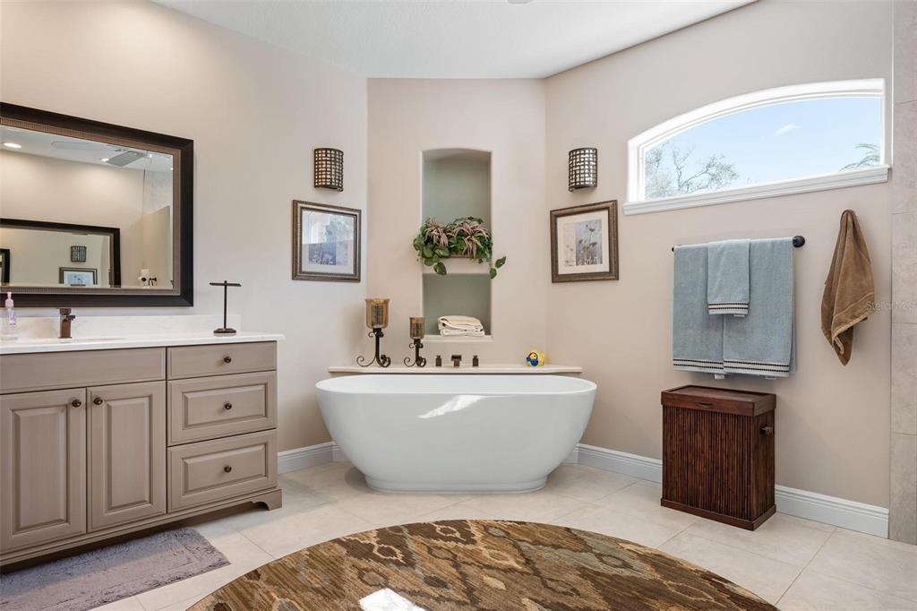 433 Tremingham Way Venice, FL 34293 - Photo 36 of 95 a spacious bathroom with a double vanity sink mirror and bathtub