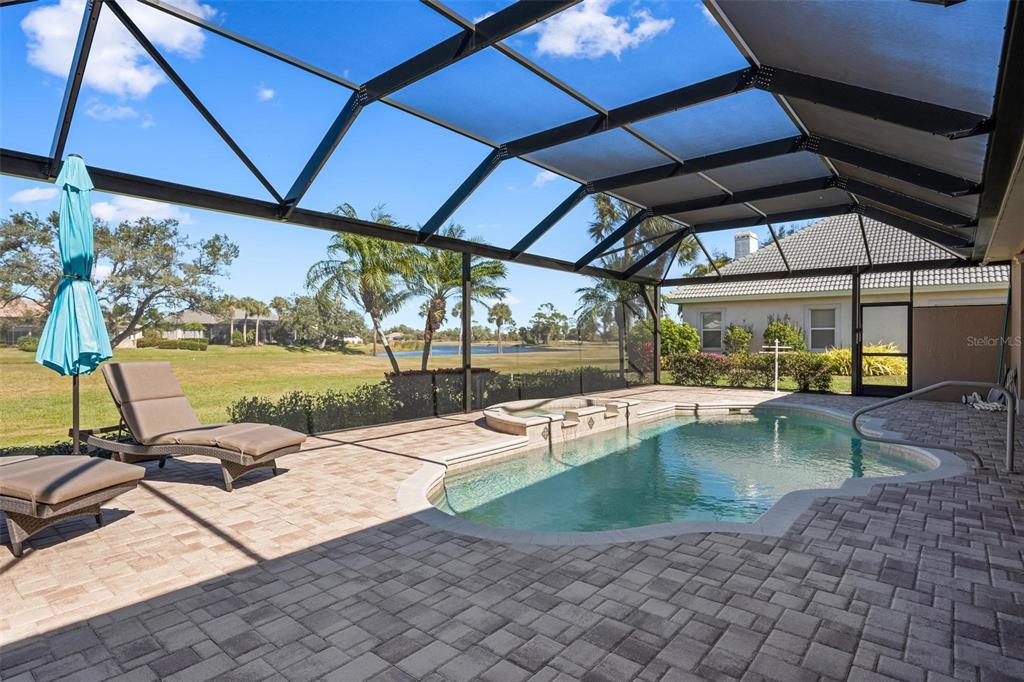 433 Tremingham Way Venice, FL 34293 - Photo 46 of 95 a view of a swimming pool with a patio
