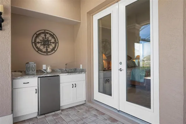 a view of a room with lots of wooden furniture