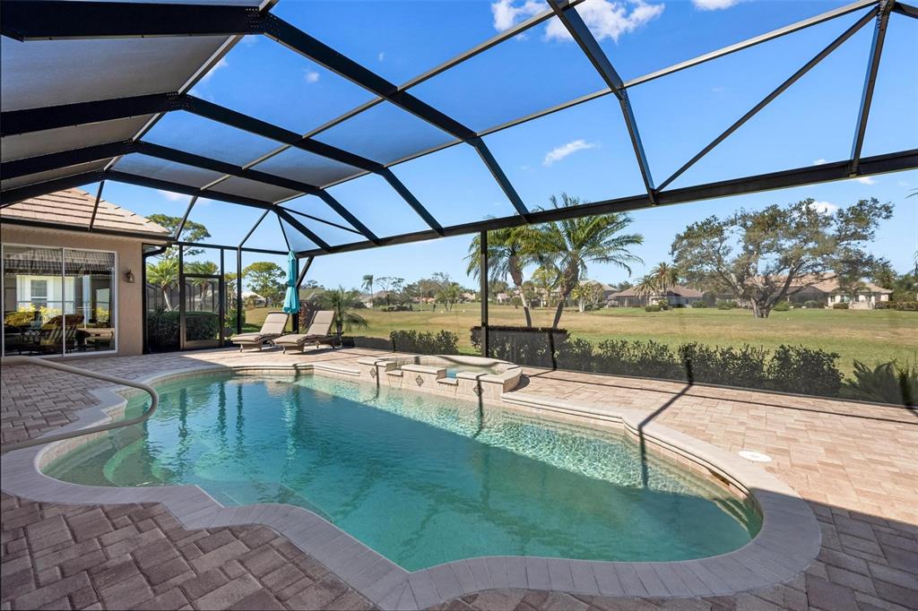 433 Tremingham Way Venice, FL 34293 - Photo 49 of 95 a view of a swimming pool with a patio
