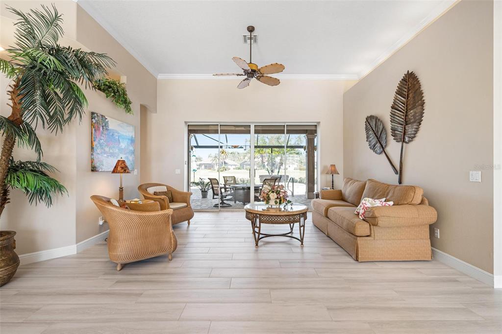 433 Tremingham Way Venice, FL 34293 - Photo 5 of 95 a living room with furniture and a large window