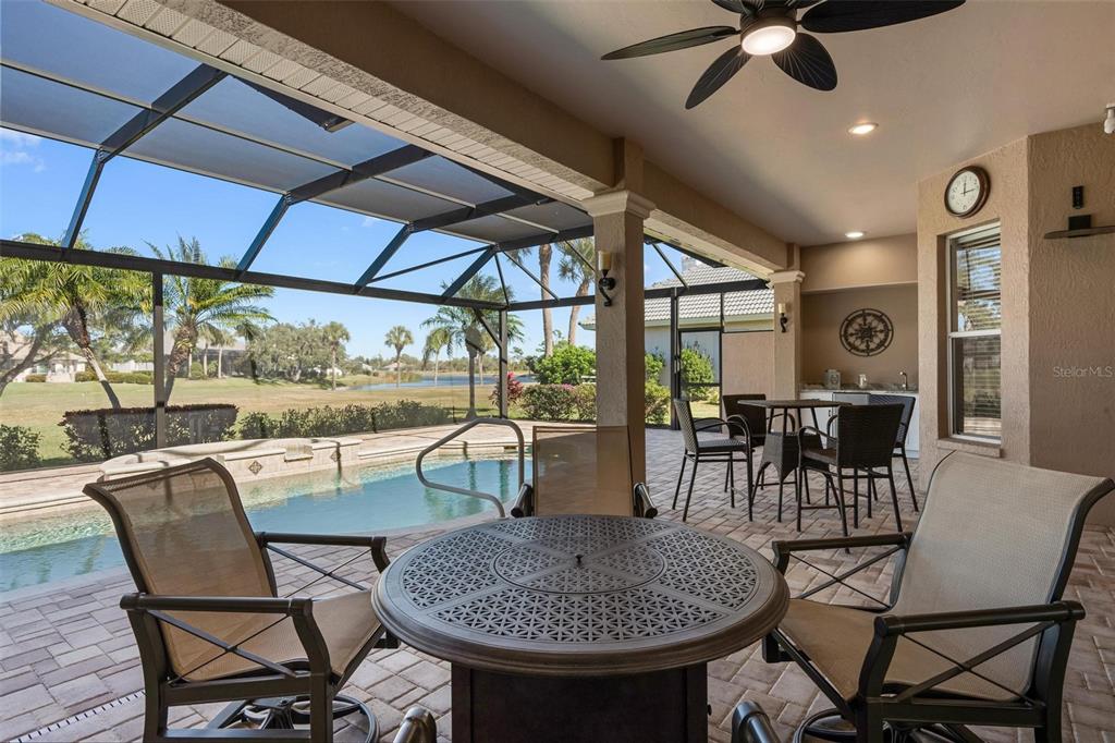 433 Tremingham Way Venice, FL 34293 - Photo 52 of 95 a dining room with furniture a rug and a large window